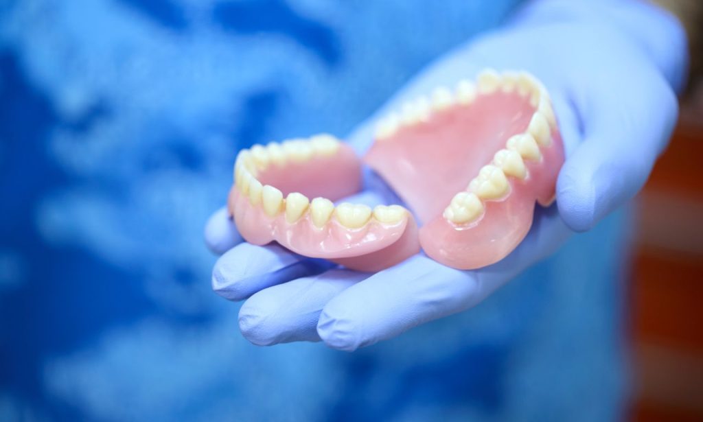 How to Keep Dentures in Place Without Adhesive